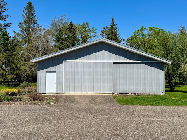 12326 Falk Trl, Northfield, MN 55057 - view of property exterior featuring a detached garage and an outdoor structure