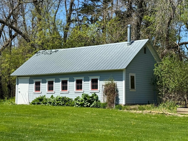 12326 Falk Trl, Northfield, MN 55057 - view of home's exterior with a yard and metal roof