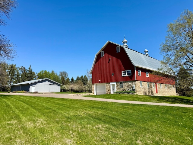 12326 Falk Trl, Northfield, MN 55057 - view of side of home with a barn, a detached garage, an outdoor structure, and a yard