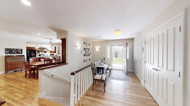 12326 Falk Trl, Northfield, MN 55057 - entrance foyer featuring baseboards, light wood-style flooring, recessed lighting, and a chandelier