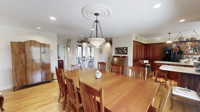 12326 Falk Trl, Northfield, MN 55057 - dining area featuring light wood finished floors, recessed lighting, and baseboards