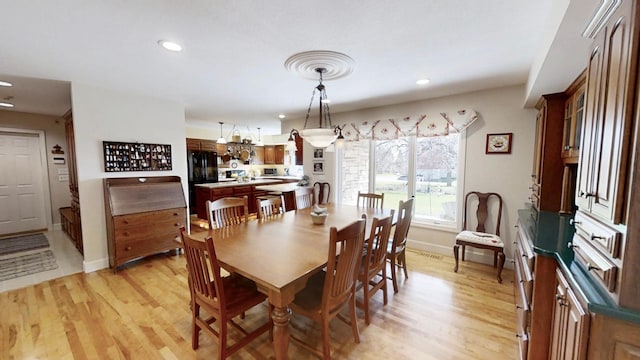 12326 Falk Trl, Northfield, MN 55057 - dining room featuring light wood-style flooring, baseboards, and recessed lighting