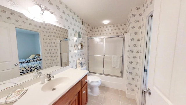 12326 Falk Trl, Northfield, MN 55057 - full bathroom with wallpapered walls, tile patterned floors, ensuite bath, vanity, and enclosed tub / shower combo
