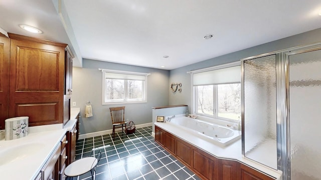 12326 Falk Trl, Northfield, MN 55057 - full bathroom featuring tile patterned flooring, a shower stall, a jetted tub, baseboards, and vanity