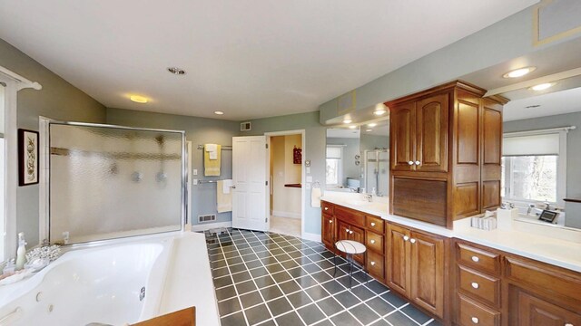 12326 Falk Trl, Northfield, MN 55057 - full bath featuring a stall shower, healthy amount of natural light, a whirlpool tub, and recessed lighting
