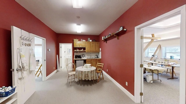 12326 Falk Trl, Northfield, MN 55057 - dining space with baseboards, light carpet, and a desk