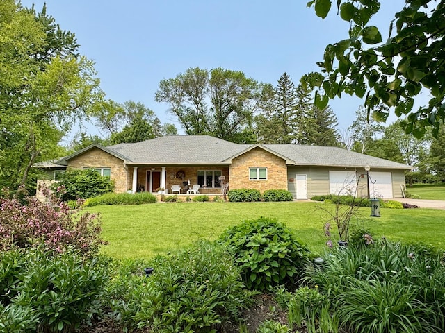 12326 Falk Trl, Northfield, MN 55057 - single story home with stone siding, a front yard, concrete driveway, covered porch, and an attached garage