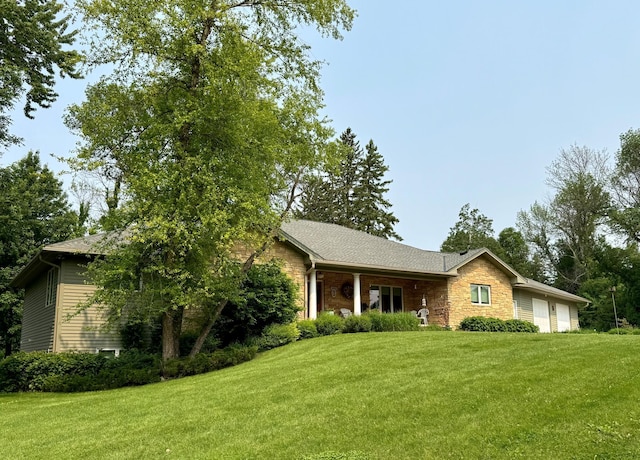 12326 Falk Trl, Northfield, MN 55057 - single story home with an attached garage, a front lawn, and stone siding