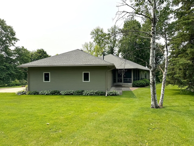 12326 Falk Trl, Northfield, MN 55057 - view of side of property featuring a lawn, a sunroom, and a shingled roof