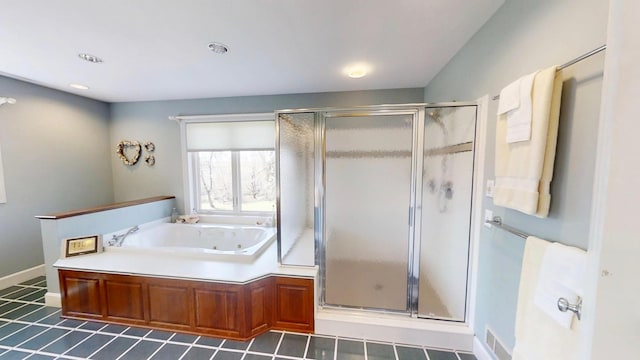 12326 Falk Trl, Northfield, MN 55057 - full bathroom with a stall shower, a tub with jets, tile patterned flooring, and recessed lighting