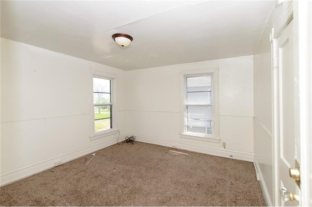 unfurnished room featuring carpet