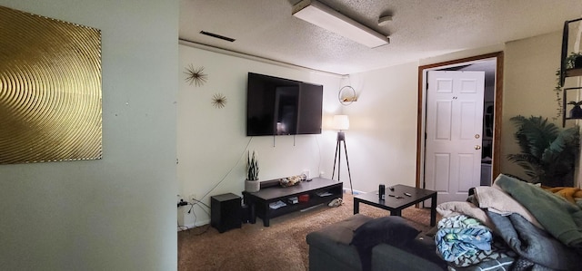 living room with carpet flooring and a textured ceiling