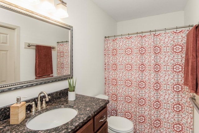 bathroom with toilet and vanity