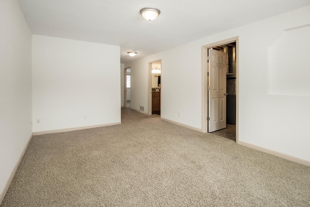 spare room with carpet flooring