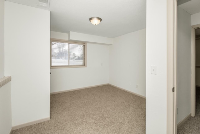 empty room with light colored carpet