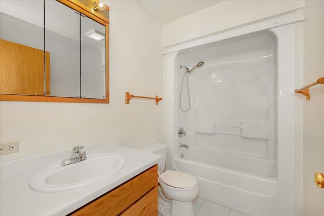 full bathroom featuring toilet, vanity, tile patterned flooring, and washtub / shower combination