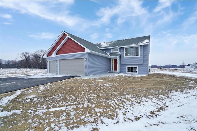 view of front of property with a garage