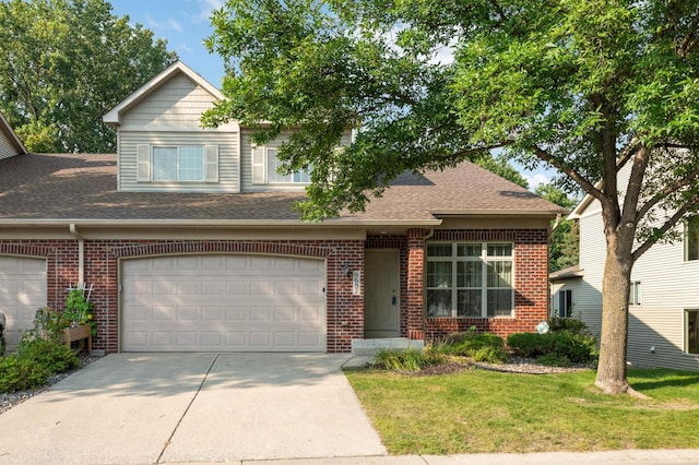 view of front of house with a front yard and a garage