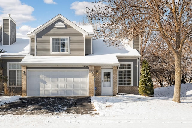 front of property with a garage