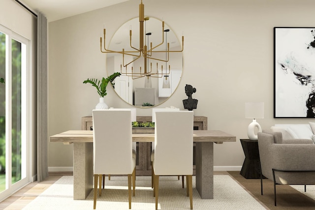 dining space featuring an inviting chandelier and baseboards