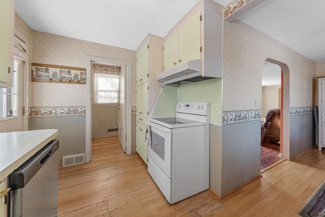 kitchen featuring white cabinetry, stainless steel dishwasher, white electric stove, and light hardwood / wood-style flooring