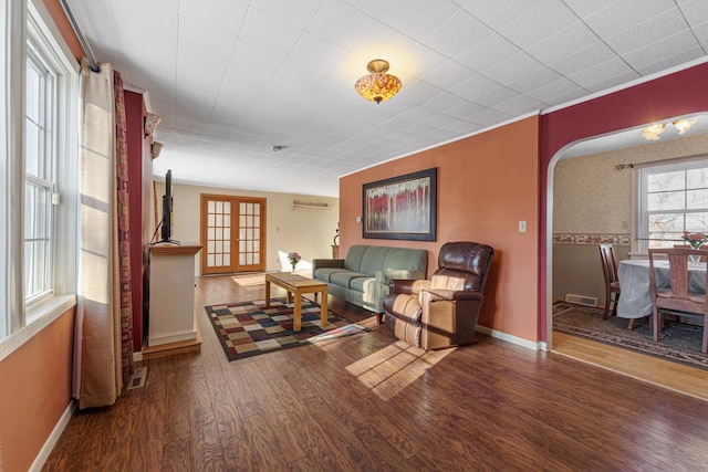 living room featuring french doors and hardwood / wood-style floors