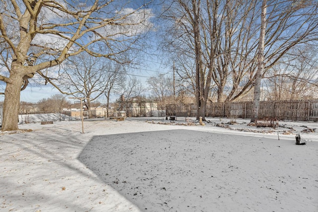 view of yard covered in snow