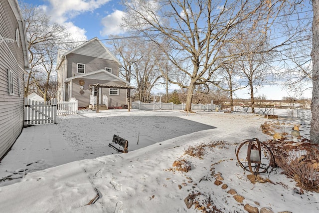 view of yard layered in snow