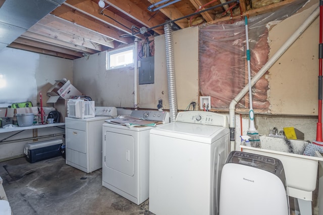 laundry area with washer and dryer and electric panel