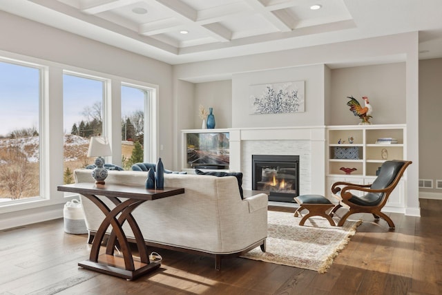 living room featuring beam ceiling, dark hardwood / wood-style flooring, and coffered ceiling