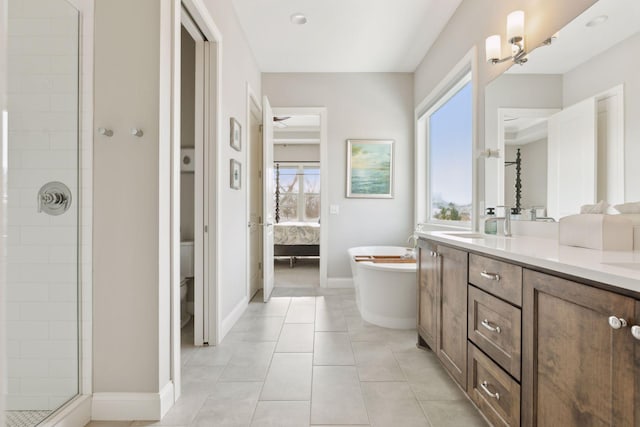 bathroom with separate shower and tub, vanity, and tile patterned flooring