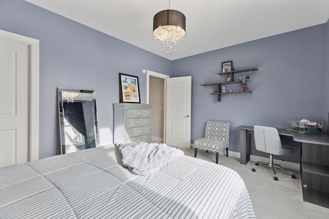 carpeted bedroom with an inviting chandelier