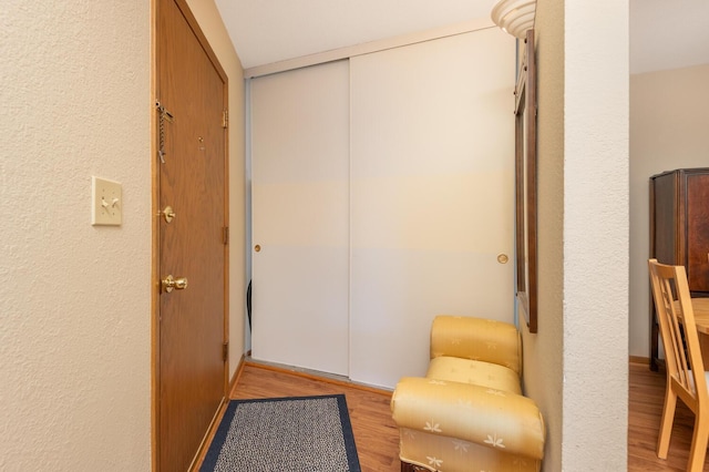 corridor featuring light hardwood / wood-style floors