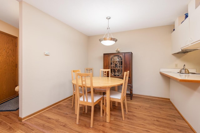 dining space featuring light hardwood / wood-style flooring