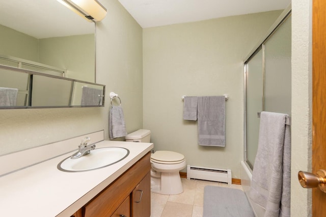 bathroom featuring a baseboard radiator, toilet, vanity, and tile patterned flooring