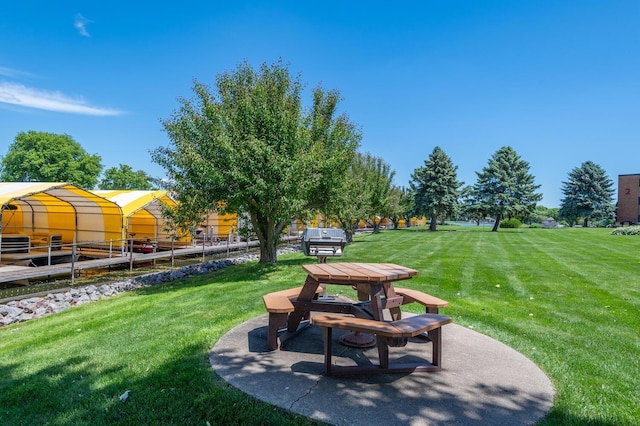 surrounding community featuring a patio area and a yard