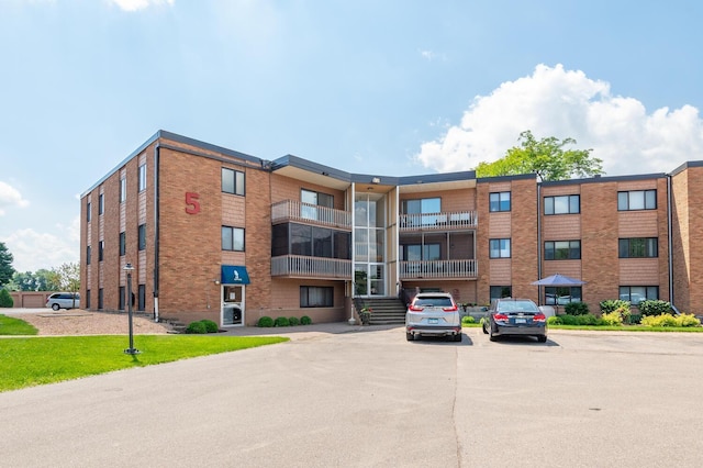 5440 Three Points Blvd Unit 525, Mound, MN 55364 - view of apartment building / complex featuring uncovered parking