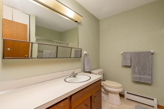 5440 Three Points Blvd Unit 525, Mound, MN 55364 - full bath with a baseboard radiator, vanity, a shower with door, and tile patterned flooring