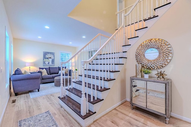 staircase featuring wood-type flooring