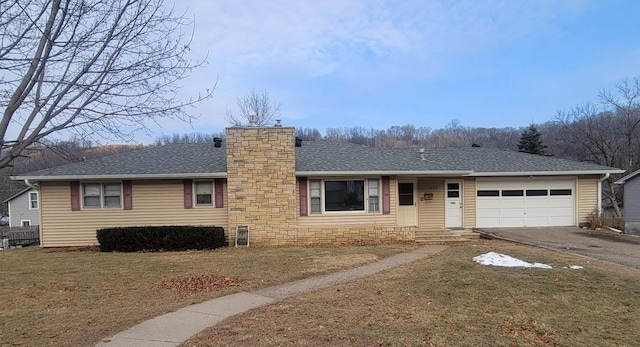 ranch-style house with a garage and a front yard