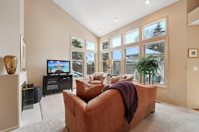 living room with high vaulted ceiling and light carpet