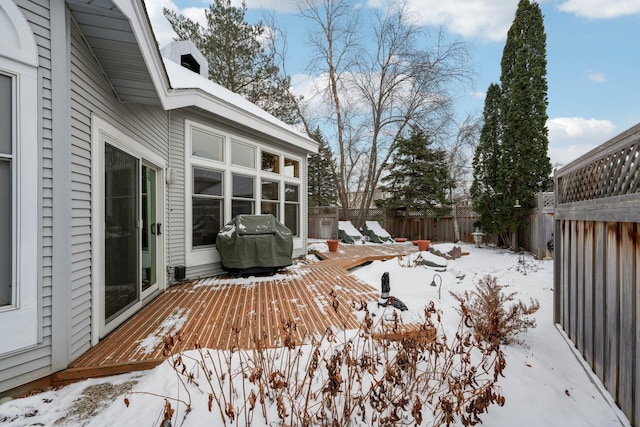 snow covered deck with area for grilling