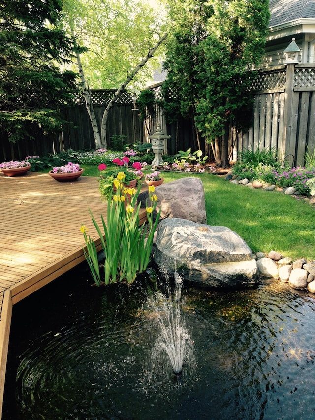 view of yard with a wooden deck