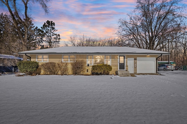 single story home with a garage