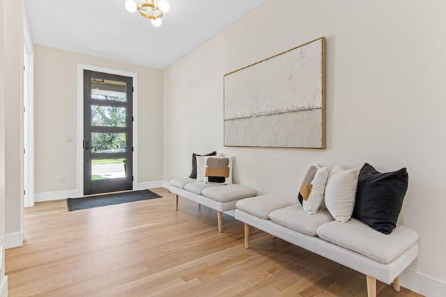 entrance foyer featuring a notable chandelier and light wood-type flooring