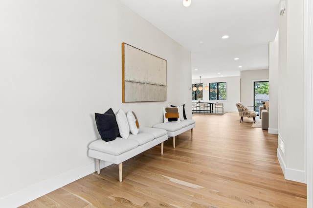 hallway with light hardwood / wood-style flooring