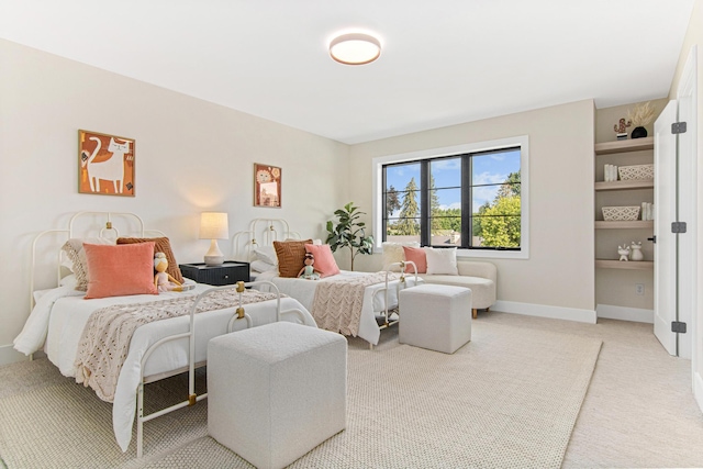 bedroom featuring light colored carpet