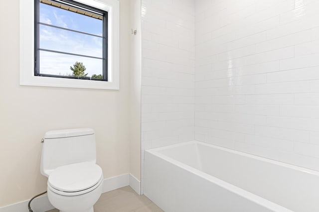 bathroom with toilet, tub / shower combination, and tile patterned floors