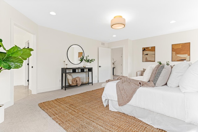 bedroom featuring light carpet