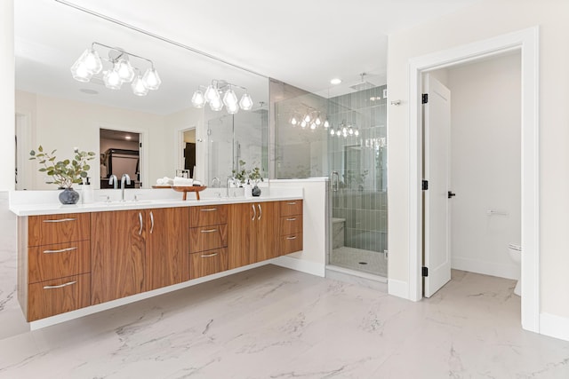 bathroom with toilet, an enclosed shower, and vanity